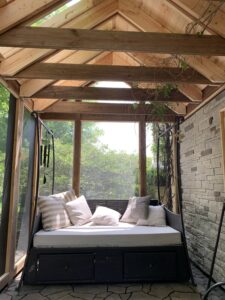 Custom 3-season porch addition featuring energy-efficient windows and a vaulted wood ceiling in Sioux Falls, SD.