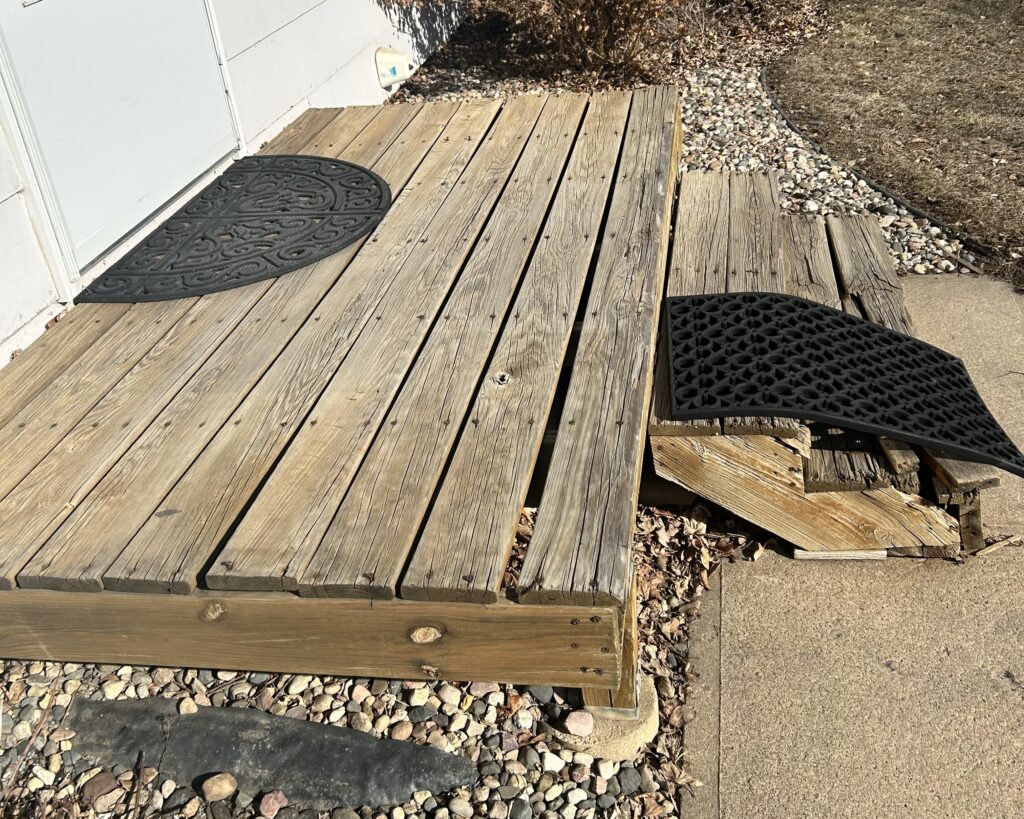 This deck step repair in Sioux Falls, SD was photographed to show the condition of the steps before we worked on them.