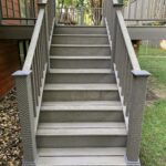 Professional deck stair replacement in a gray Timber Tech composite for a residential backyard in Canton, SD.