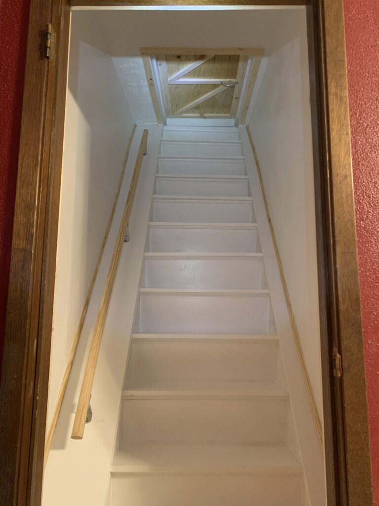 Custom attic staircase installation and finished access stairs for a residential loft conversion in Sioux Falls, SD.