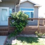 Professional custom deck construction and backyard outdoor living space installation for a new residential home in Tea, SD.