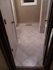 Professional ceramic and porcelain tile floor installation and grout repair by a local handyman in Harrisburg, SD.