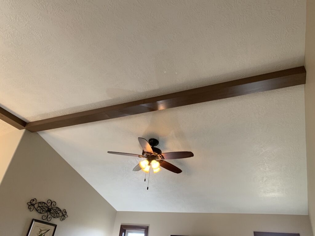 Custom poplar wood ceiling boxes installed to finish the underside of a gable ceiling in Sioux Falls, SD.