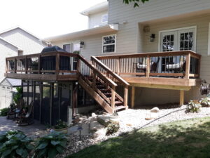 Custom residential deck addition and backyard expansion featuring professional construction in Sioux Falls, SD.