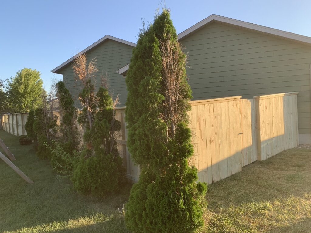 Professional residential fence installation and custom privacy fencing for a backyard in Brandon, SD.