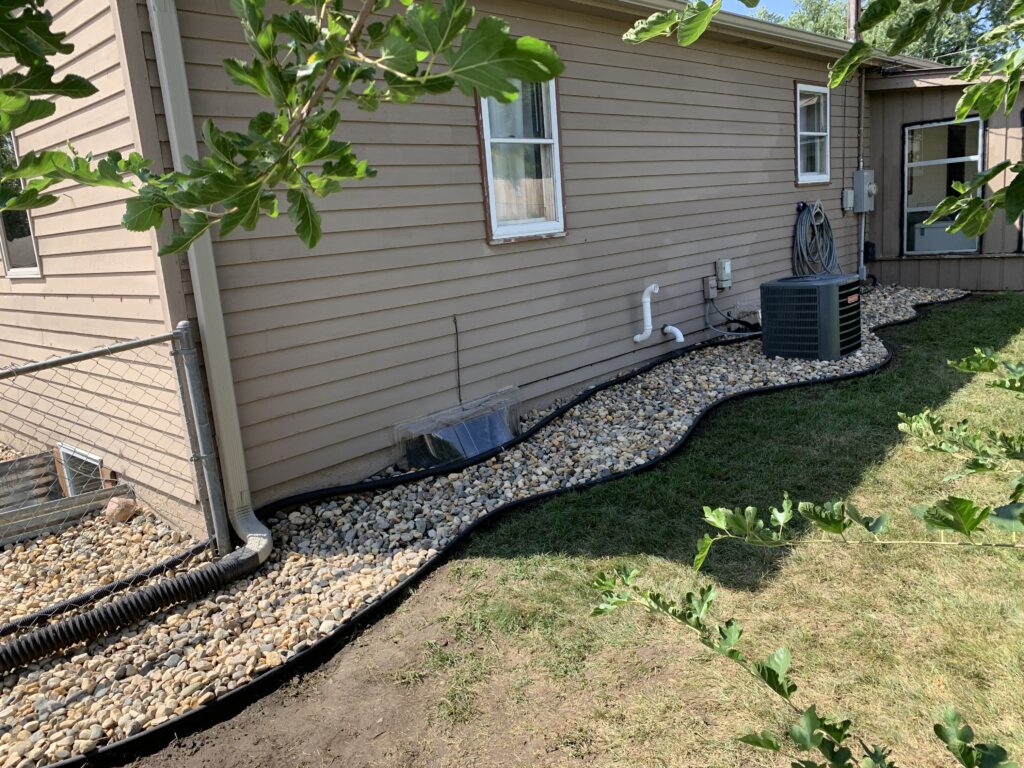 Custom residential landscaping and paver patio installation for a backyard in Harrisburg, SD.