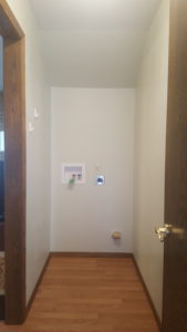 Custom main floor laundry room renovation with built-in cabinetry and functional storage solutions in Brandon, SD.