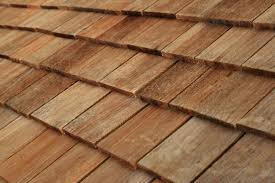 Professional cedar shingle roof repair, drip edge tin, and down spout gutter stabilization in Sioux Falls, SD.